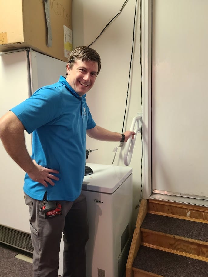 Tye finishing an appliance repair